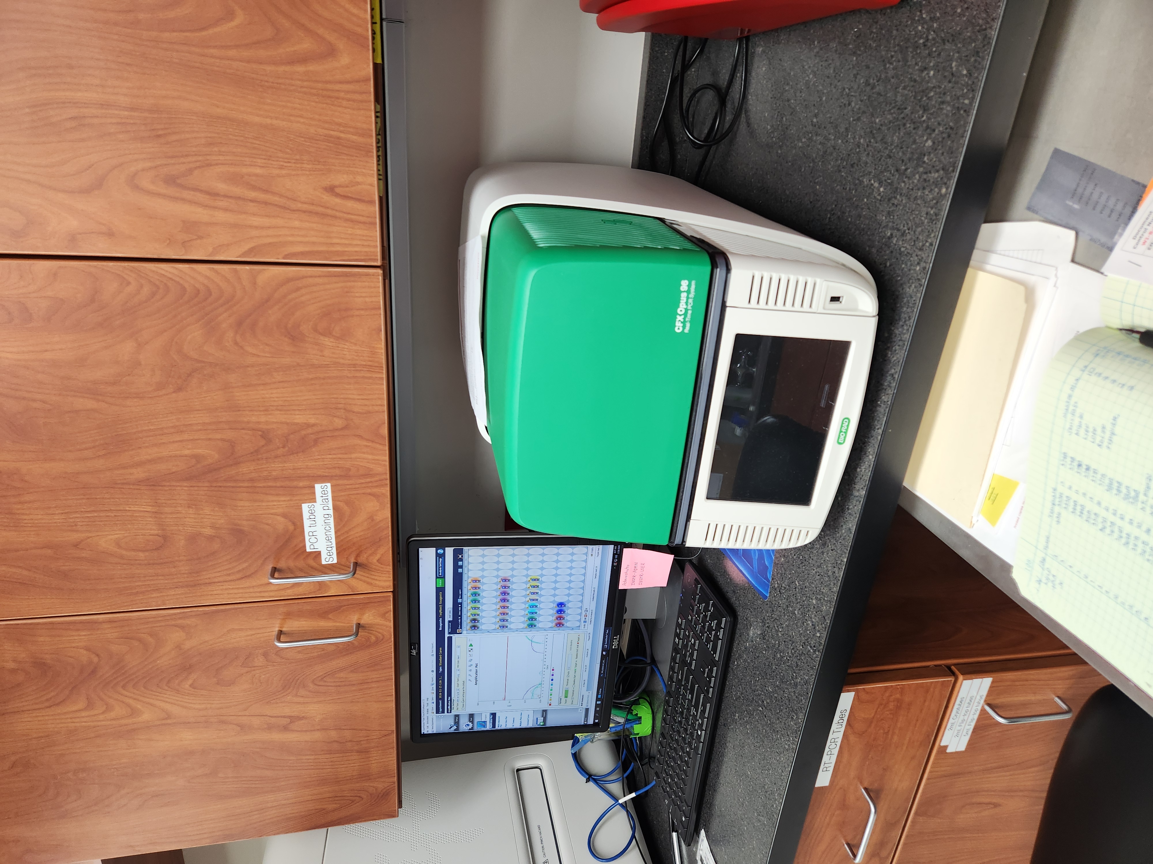 a PCR machine on a desk.